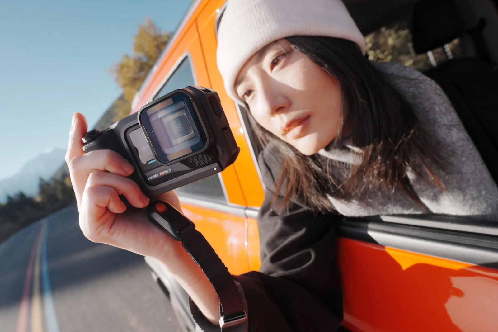 Ace Pro 2 filming out of an orange van window on a mountain road